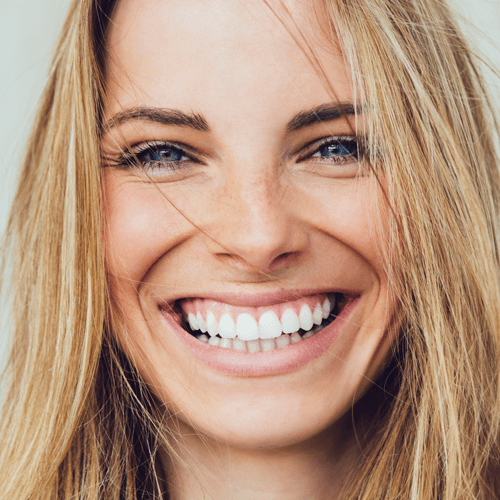 Happy young women with natural looking dentures