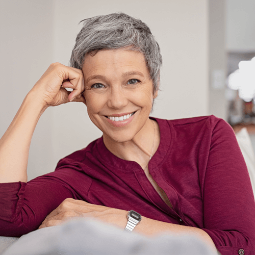 Smiling senior wearing natural looking white dentures