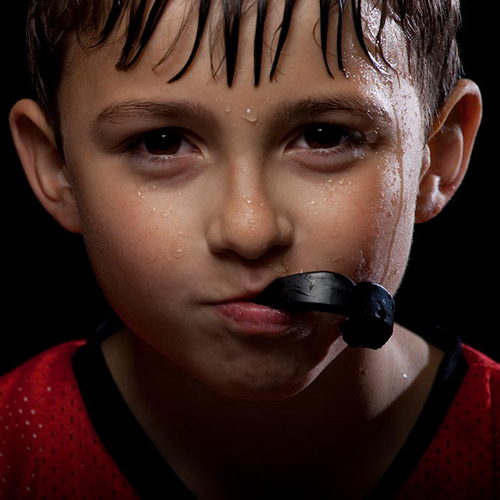 child-wearing-sports-mouthguard Child wearing protective sports mouthguard