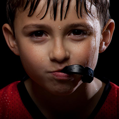 Child wearing protective sports mouthguard